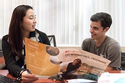 A Study Abroad staff advising a student.
