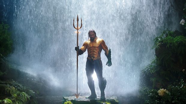A photo of Aquaman in a movie poster. 