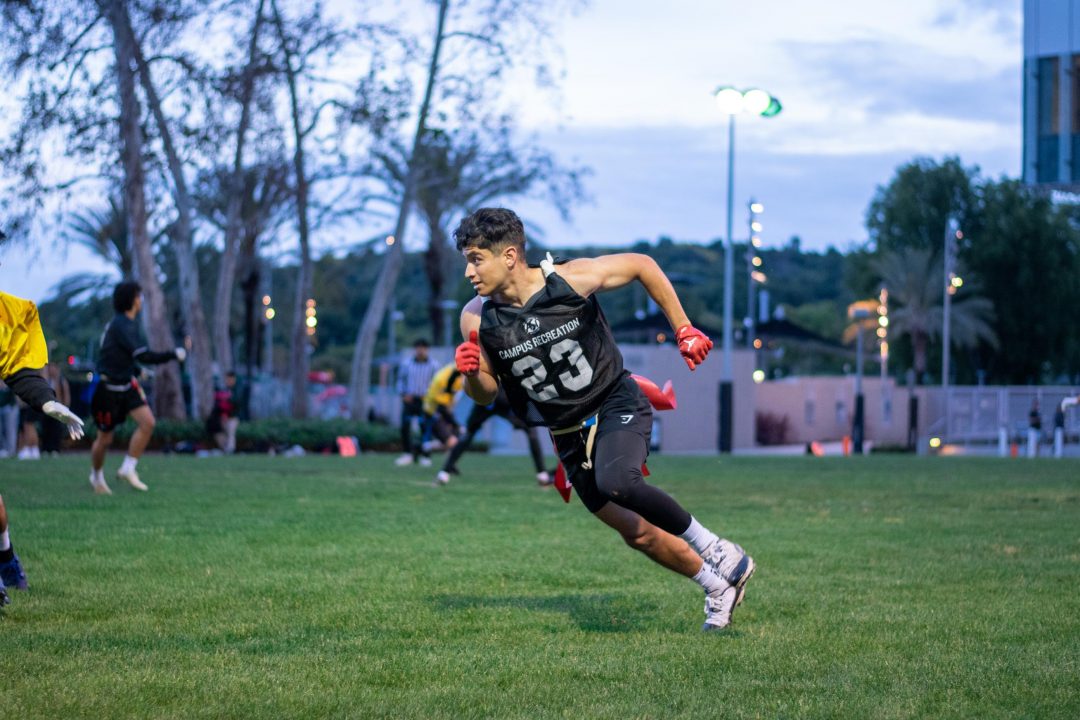 Student running in a flag football game