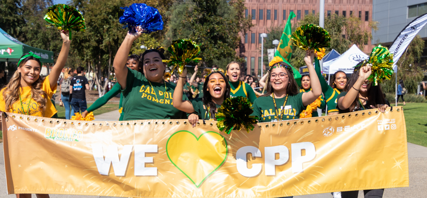 BEAT students celebrating while holding a CPP banner