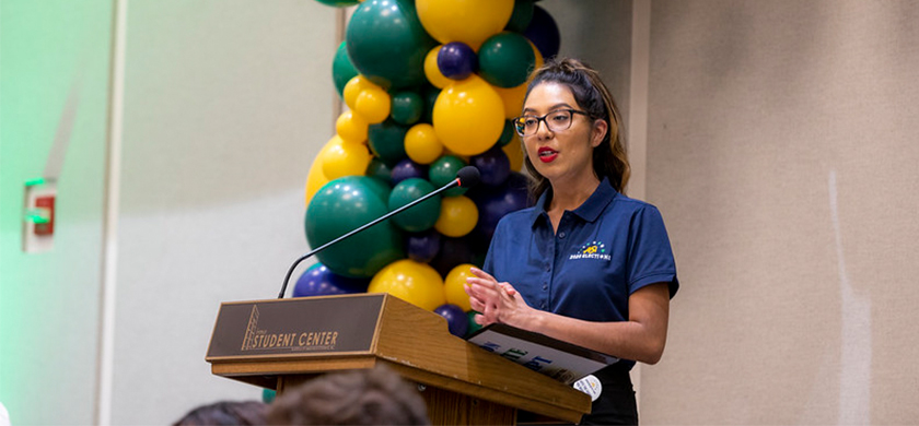 Student Government representative talking at an event