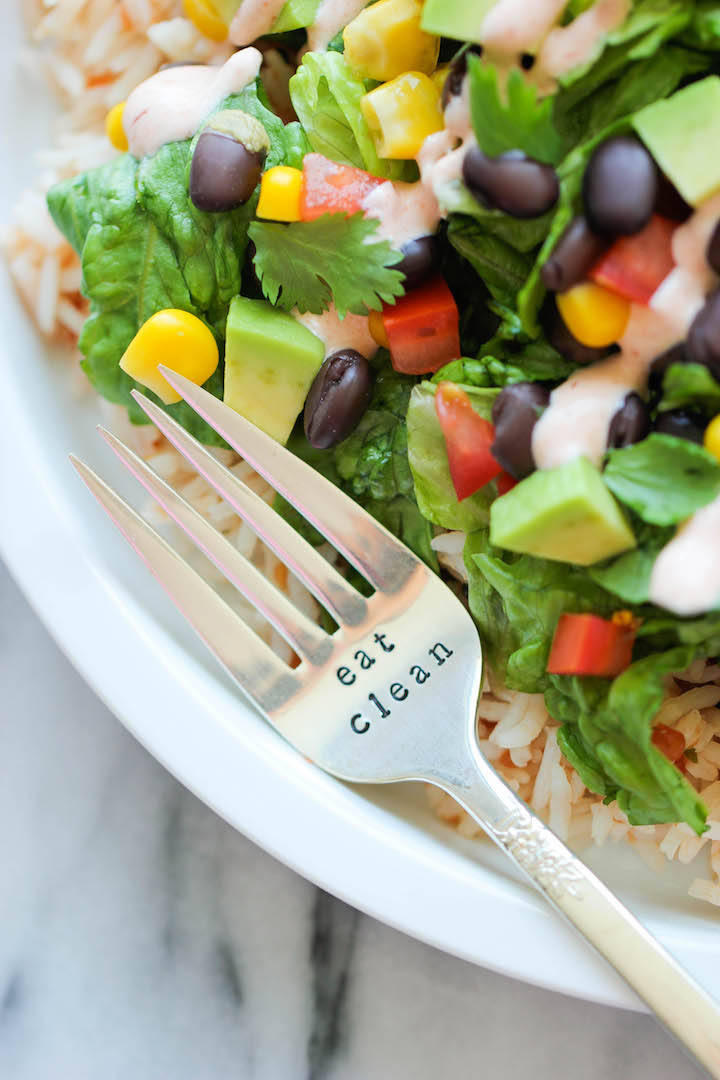 close up photo of a burrito bowl with a fork labelled eat clean