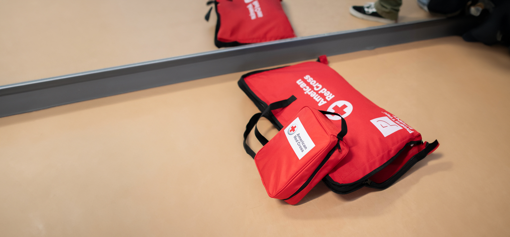 Red Cross bags on the floor