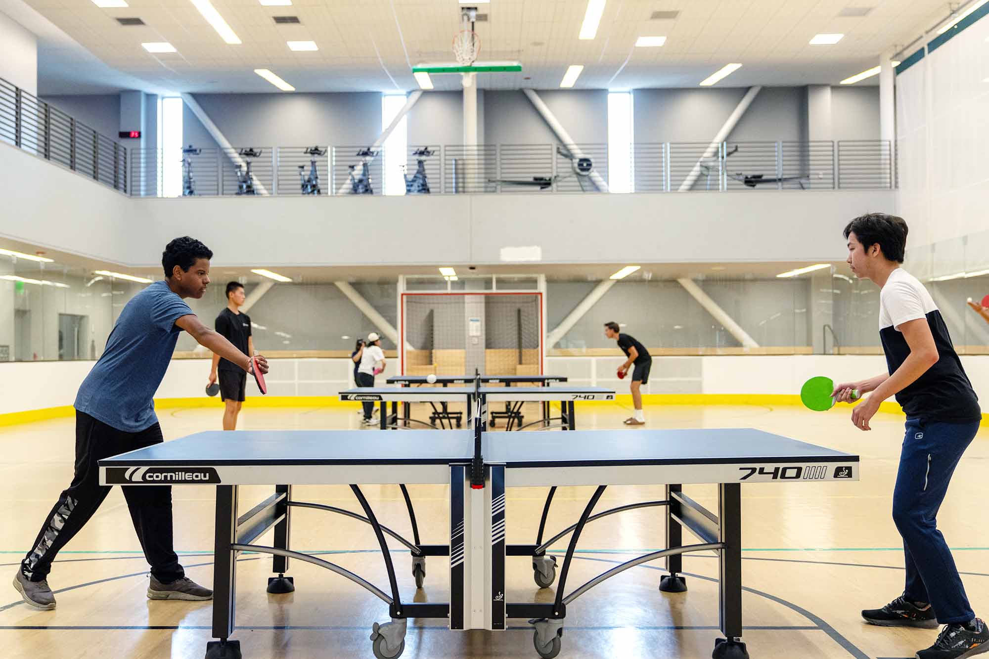 Students playing in a ping pong tournament