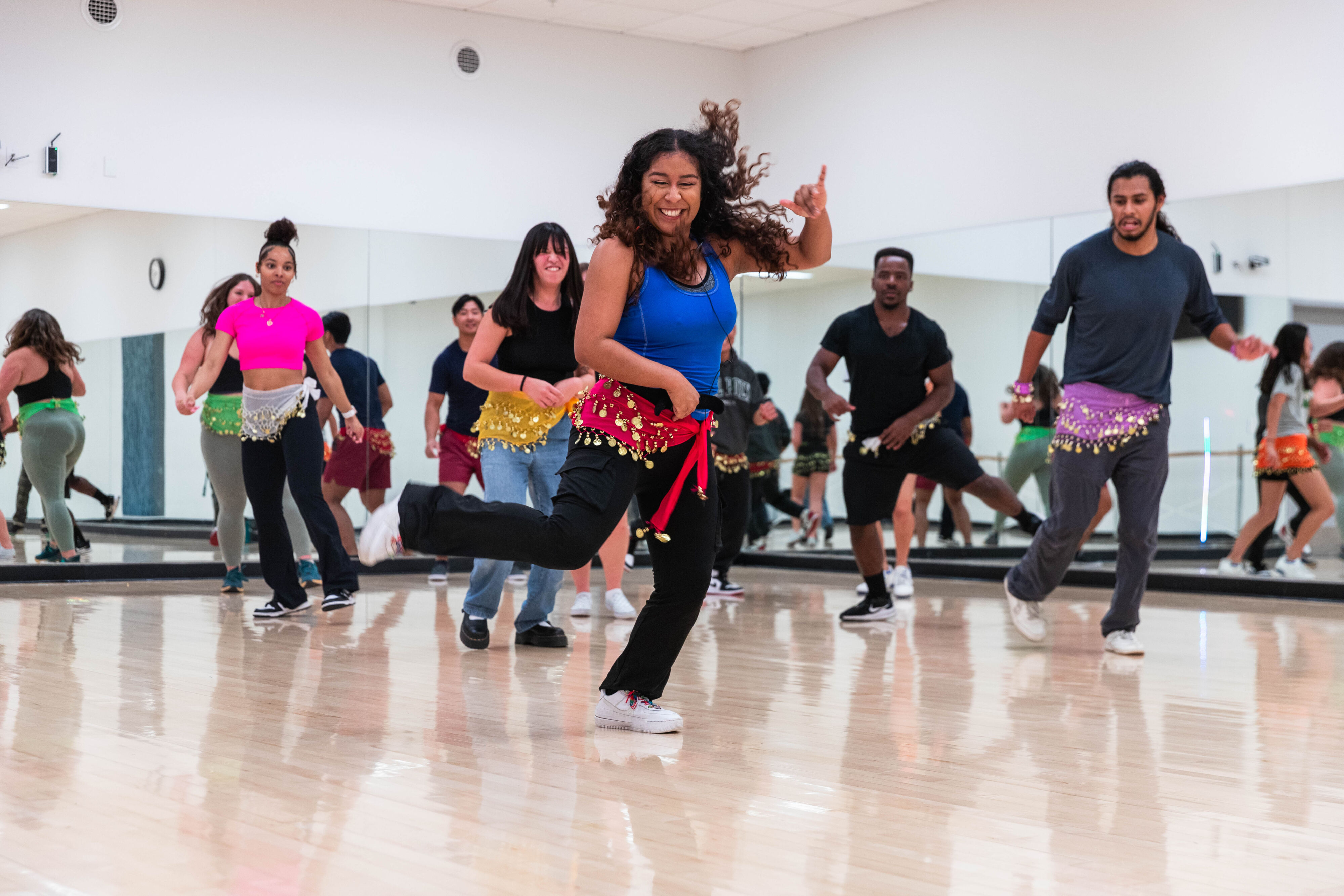 instructor leading a dance class in a studio