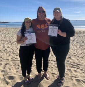 Maggie Dillion and Brenda Calderon accepting certifications from the ASI Dive Center