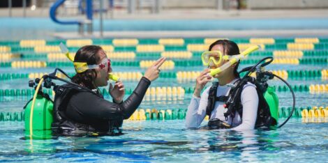 Instructor working with a participant at ASI Dive Center program