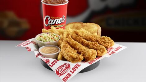 Cane's coleslaw, chicken fingers, texas toast, drink, and signature sauce